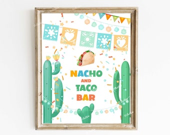May include: A printable sign with a white background featuring a colorful illustration of a taco, cacti, and confetti. The text "Nacho and Taco Bar" is written in colorful letters.