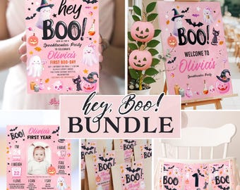 May include: A collection of pink Halloween party decorations. Includes invitations, a welcome sign, favor bags, and a high chair banner. The designs feature ghosts, bats, pumpkins, and the text "hey BOO!" and "Olivia's First Boo-Day".