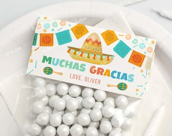 May include: A white favor bag with a colorful printable tag that says "Muchas Gracias" with a sombrero and maracas. The tag also says "Love, Oliver".