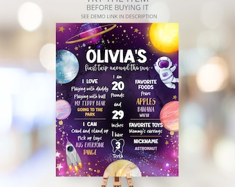May include: A purple and gold space-themed first birthday milestone poster with the name Olivia. The poster features planets, stars, and a rocket ship. It includes details like Olivia's age, weight, height, favorite foods, and toys.