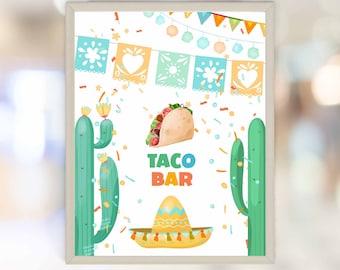 May include: A printable sign for a taco bar with a cartoon taco, cactus, and sombrero. The sign says "Taco Bar" in colorful letters.