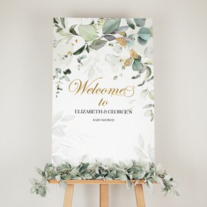 Puede incluir: Bienvenido a la fiesta de bienvenida al bebé de Elizabeth y George, cartel con un diseño de acuarela de hojas verdes y detalles dorados.