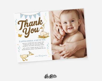 May include: A baby thank you card with a cartoon goose illustration and the words "Thank You". The card includes the text "A LITTLE GIGGLE, A LOT OF FUN" and a photo of a smiling baby. The card is light in color.