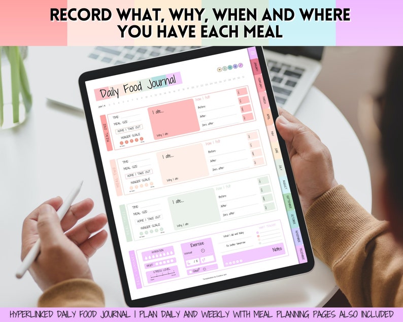 May include: A digital tablet displaying a daily food journal template with sections for meal time, what was eaten, hunger scale, and notes. The tablet is being held by a person's hand.