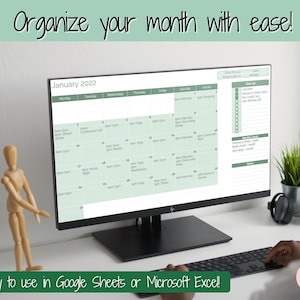 May include: A computer monitor displaying a printable calendar for January 2022. The calendar is designed to be used in Google Sheets or Microsoft Excel. The calendar has a green and white color scheme and includes space for daily tasks and notes.