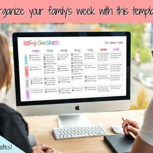 May include: A computer screen displaying a printable family chore chart template. The chart is color-coded and includes a list of chores for each day of the week. The text on the screen reads "Family Chore Chart" and "The Johnson Family".