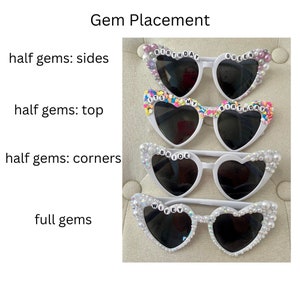 May include: Four pairs of white heart-shaped sunglasses with different embellishments. The top pair has pink and white gems and the text "Birthday Queen". The second pair has colorful gems and the text "It's My Birthday". The third pair has white gems and the text "Bride". The bottom pair has white gems and the text "Wifey".