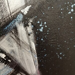May include: Abstract painting with black, white, and blue paint. The painting has a textured surface and a splattered effect.