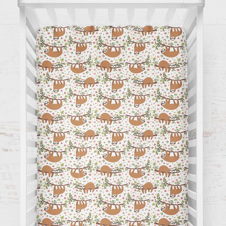 Bedding set in crib for a girl with a sloth bumper coral Etsy