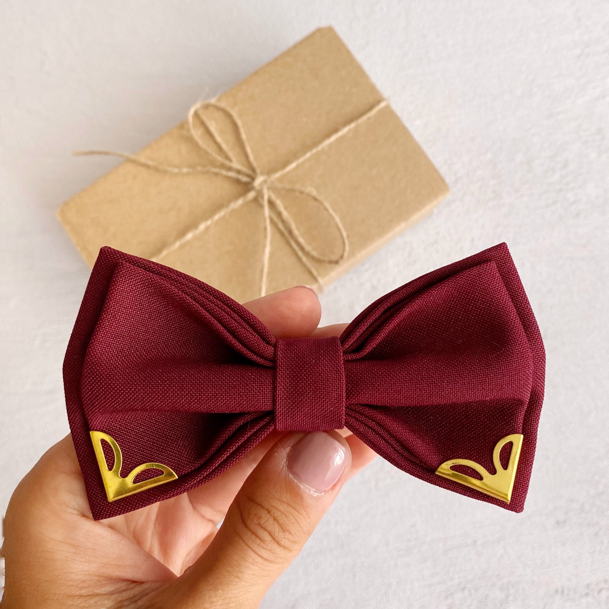 wine and gold bow tie