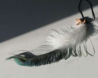 Long pendant with peacock pen, maramut and mountain crystal.
