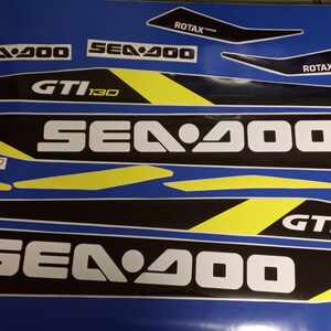 May include: A set of black and yellow Sea-Doo decals with the text "Sea-Doo", "GTI 130", and "ROTAX" in white.