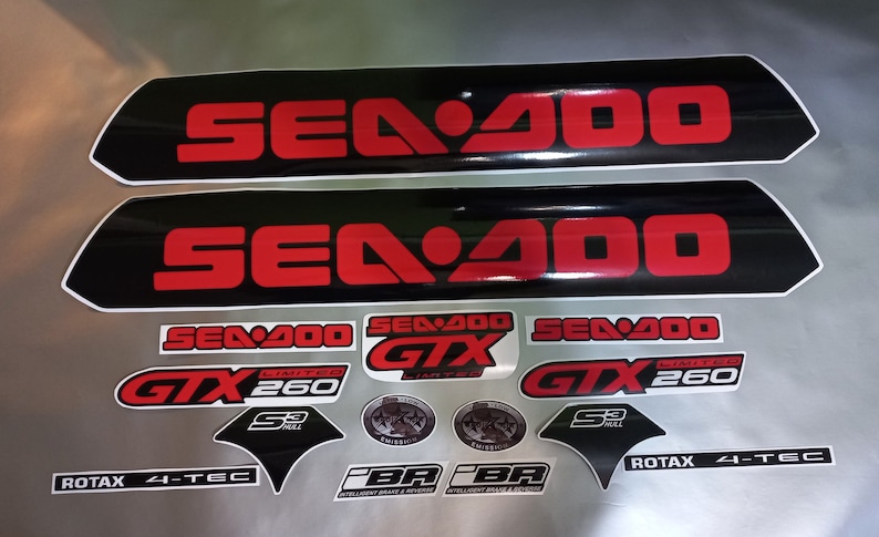 May include: A set of black and red Sea-Doo decals with the text "Sea-Doo", "GTX", "Limited", "260", "S3 Hull", "Rotax 4-Tec", and "iBR" in white and black lettering.
