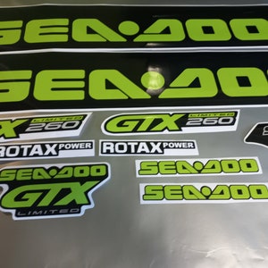 May include: A set of black and green Sea-Doo GTX Limited 260 decals. The decals feature the Sea-Doo logo, GTX logo, Limited 260 text, and Rotax Power text.