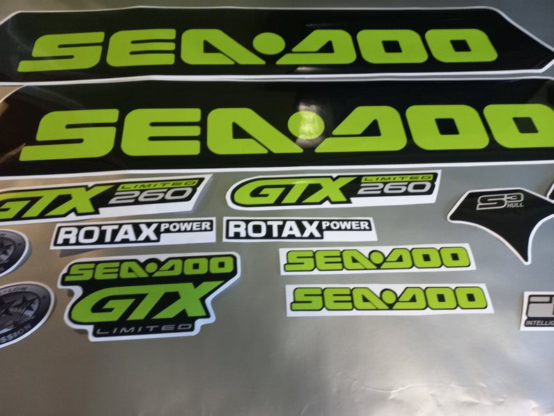 May include: A set of black and green Sea-Doo GTX Limited 260 decals. The decals feature the Sea-Doo logo, GTX logo, Limited 260 text, and Rotax Power text.
