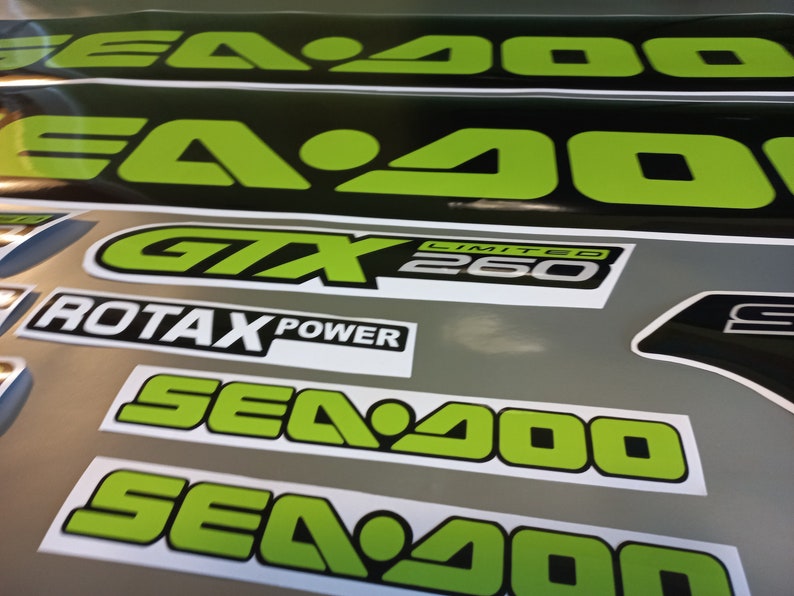 May include: A set of black and green Sea-Doo decals with the text "Sea-Doo", "GTX Limited 260", and "Rotax Power".