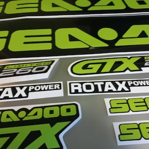 May include: A set of black and green Sea-Doo decals with the text "Sea-Doo", "GTX", "Limited 260", and "Rotax Power".