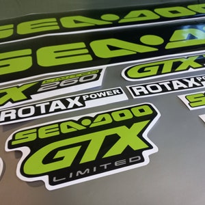 May include: A set of black and green Sea-Doo GTX Limited 260 decals. The decals feature the Sea-Doo logo, GTX logo, Limited 260 text, and Rotax Power text.