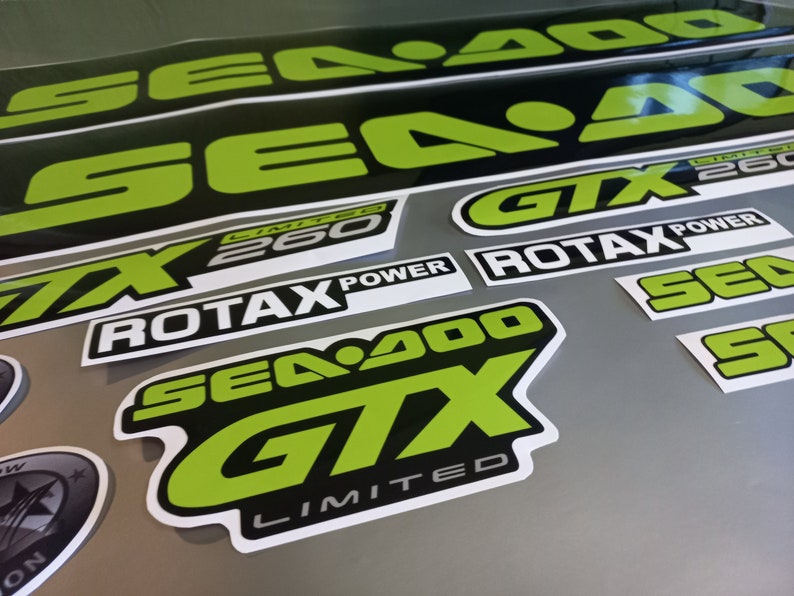 May include: A set of black and green Sea-Doo GTX Limited 260 decals. The decals feature the Sea-Doo logo, GTX logo, Limited 260 text, and Rotax Power text.