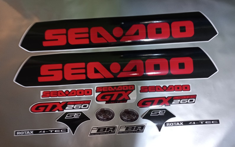 May include: A set of black and red Sea-Doo decals with the text "Sea-Doo", "GTX", "Limited", "260", "S3 Hull", "Rotax 4-Tec", and "PBR" in white.