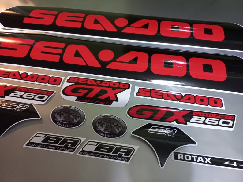 May include: A set of black and red Sea-Doo GTX Limited 260 decals. The decals include the Sea-Doo logo, GTX Limited, 260, S3 Hull, Emission, and Intelligent Brake & Reverse (iBR).