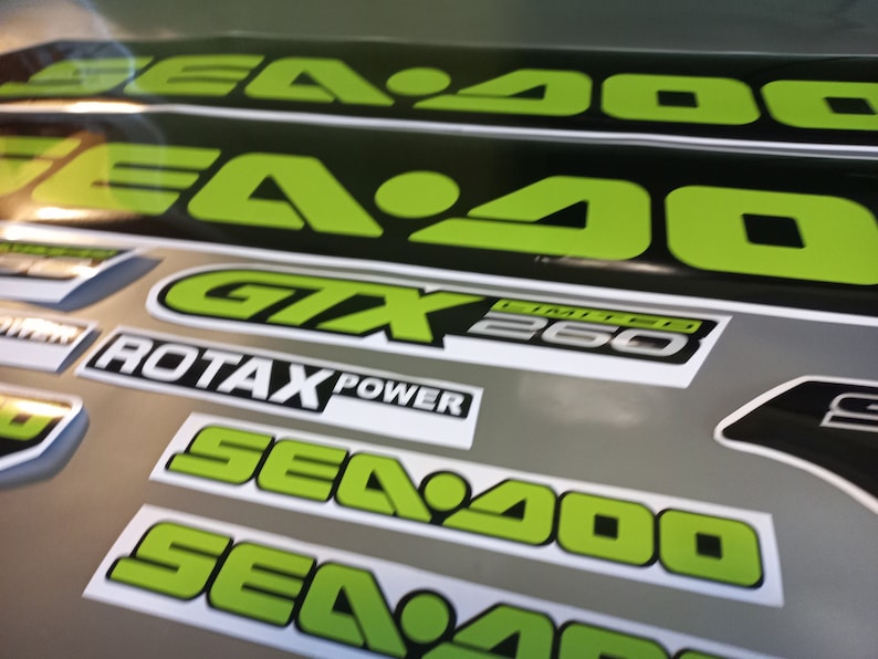 May include: A set of black and green Sea-Doo decals with the text "Sea-Doo", "GTX Limited 260", and "Rotax Power".