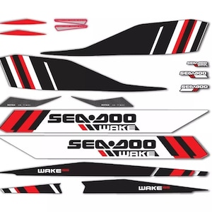 May include: A set of black, white and red Sea-Doo Wake 155 decals. The decals feature the Sea-Doo logo and the text "Sea-Doo Wake 155".
