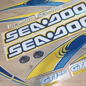 May include: A set of yellow and blue decals with the text "SEA 200" and "GTISE 4-TEC".