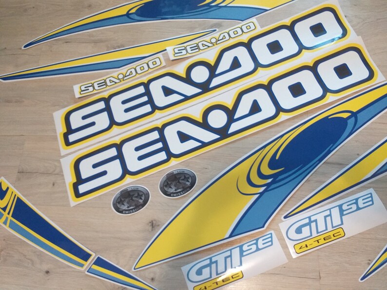 May include: A set of yellow and blue decals with the text "SEA 200" and "GTISE 4-TEC".