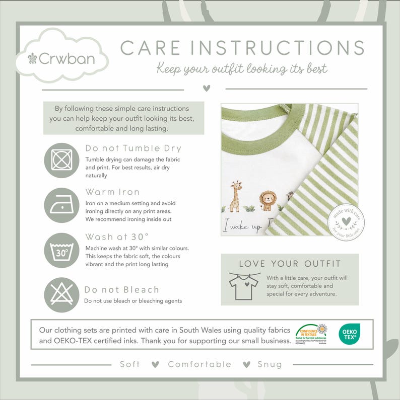 May include: Care instructions graphic with a white and green striped long-sleeved shirt. The shirt has a green collar and features a giraffe, lion, and text that reads "I wake up". The graphic also includes washing instructions.