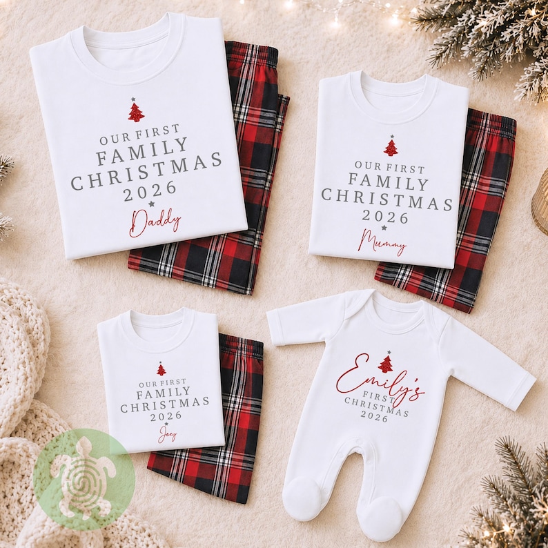 May include: A set of matching family pajamas featuring white t-shirts and a long-sleeve baby onesie with red and black plaid pants. The shirts are printed with a red Christmas tree and the text Our First Family Christmas 2026 with names.