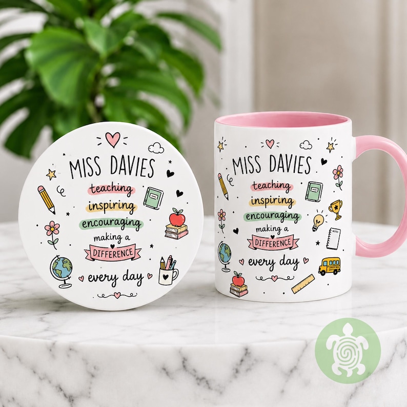 May include: A white ceramic mug and matching round coaster featuring a pink interior and handle. The design includes the text "MISS DAVIES" and "teaching inspiring encouraging making a difference every day" surrounded by colorful school-themed icons.