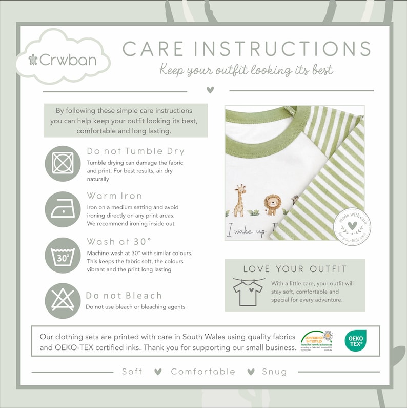 May include: A care instruction card for a Crwban clothing set featuring a white shirt with green striped sleeves and a giraffe and lion graphic. The text includes washing guidelines, OEKO-TEX certification, and the phrase I wake up.