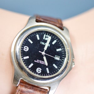 Nautica , steel tone with black dial, quartz wrist watch