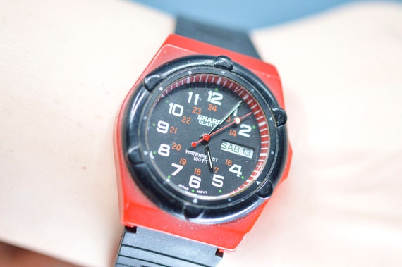 Sharp , red and black tone,quartz wrist watch