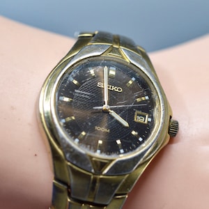 Seiko, silver and gold tone, quartz wrist watch