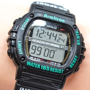 Armitron, black and greem tone, digital wrist watch