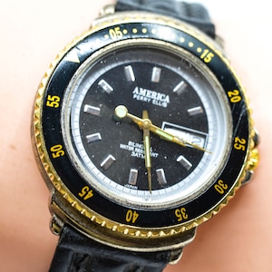 Perry Ellis America, black aand gold tone, quartz wrist watch - works but needs repair