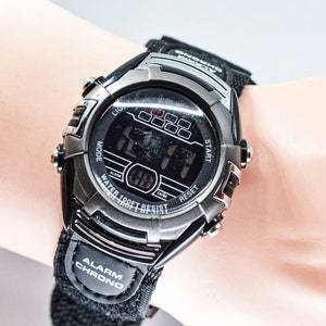 Black tone mans digital , sports wrist watch