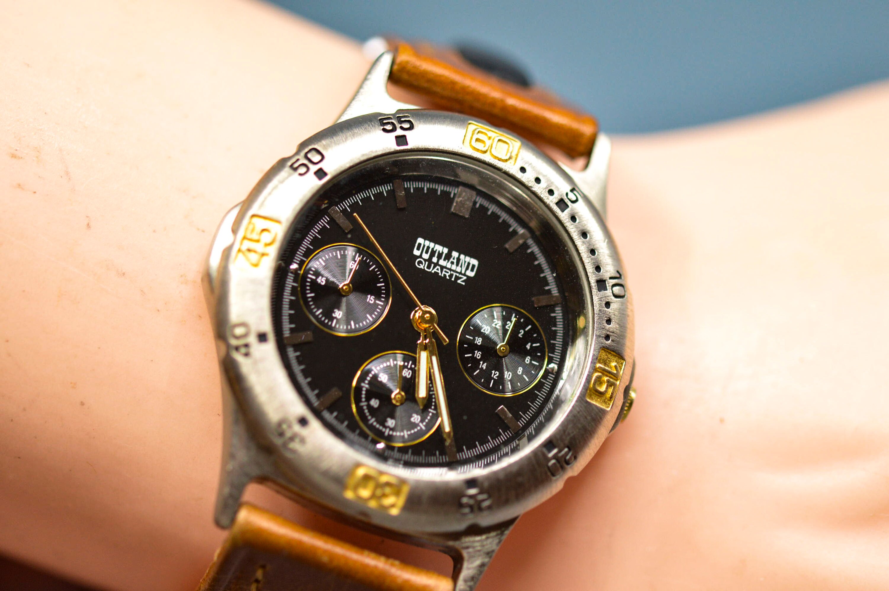 Outland, steel tone with black dial, quartz wrist watch