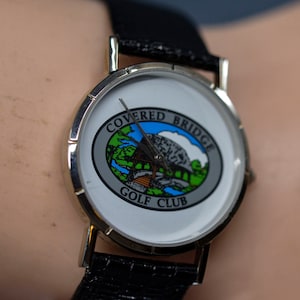 Steel tone with whie dial, gold club, promotional , quartz wrist watch
