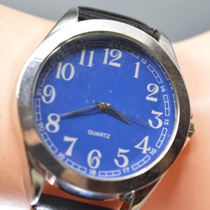 Steel tone with blue dial, large quartz wrist watch
