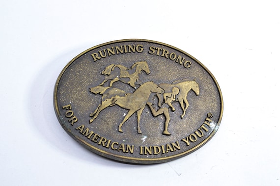 Running strong for American Indian youth , brass belt buckle