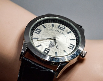 US Polo Assn . steel tone with silver dial mans wrist watch