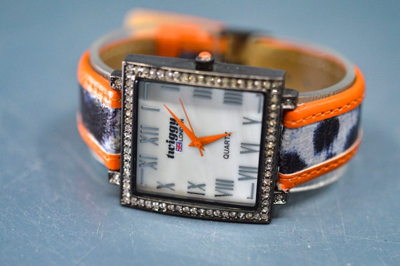 Twiggy London, dark steel tone, orange bracelet, … - image 1
