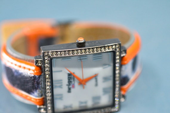 Twiggy London, dark steel tone, orange bracelet, … - image 3