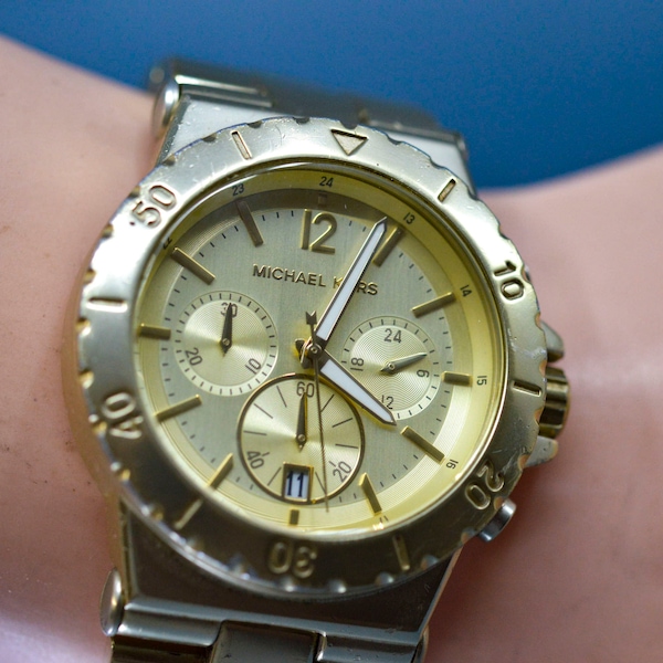 Michael Kors. gold tone, light weight, quartz wrist watch