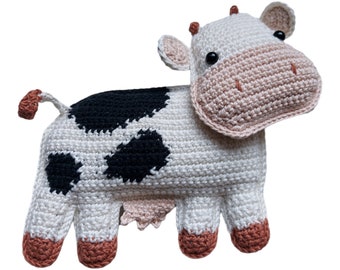 A flat cow cuddly toy that is easy to hold