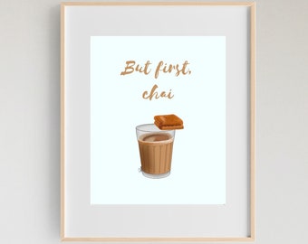 May include: A framed print with the text "But first, chai" and an illustration of a glass of chai with a biscuit on top.