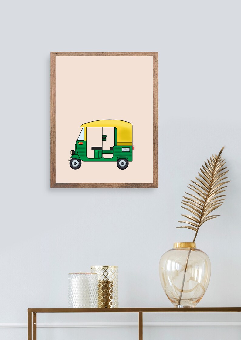May include: A framed illustration of a green and yellow auto rickshaw, also known as a tuk-tuk, on a light peach background.